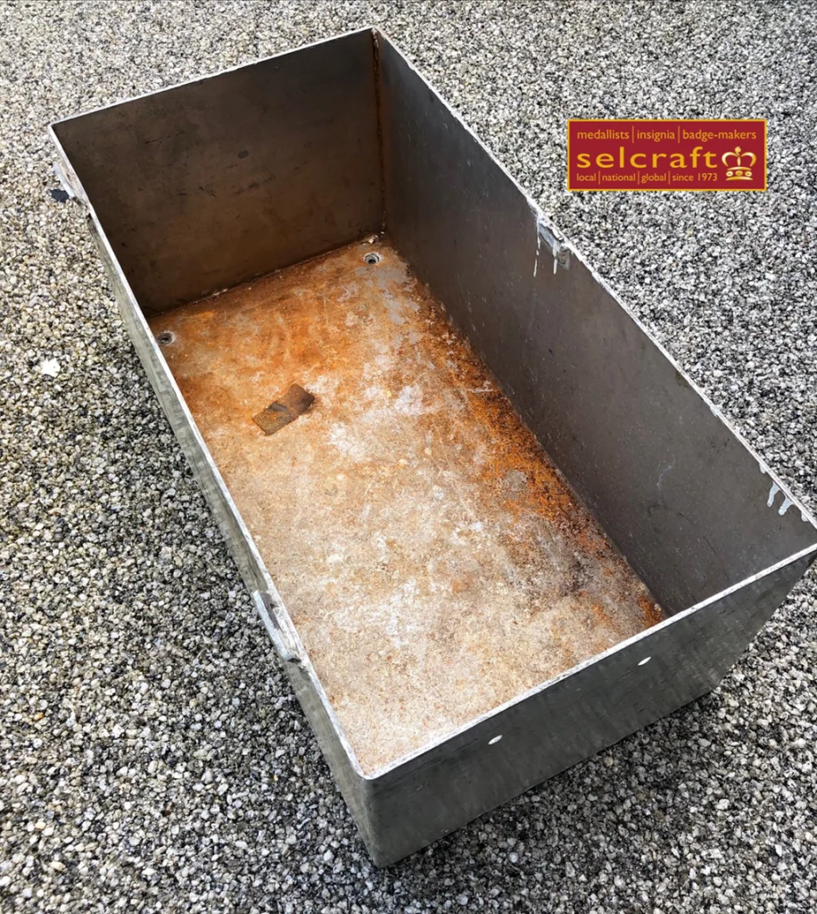 Image of the HMS Dreadnought storage bin supplied to Selcraft to use as source material for the lapel pin.