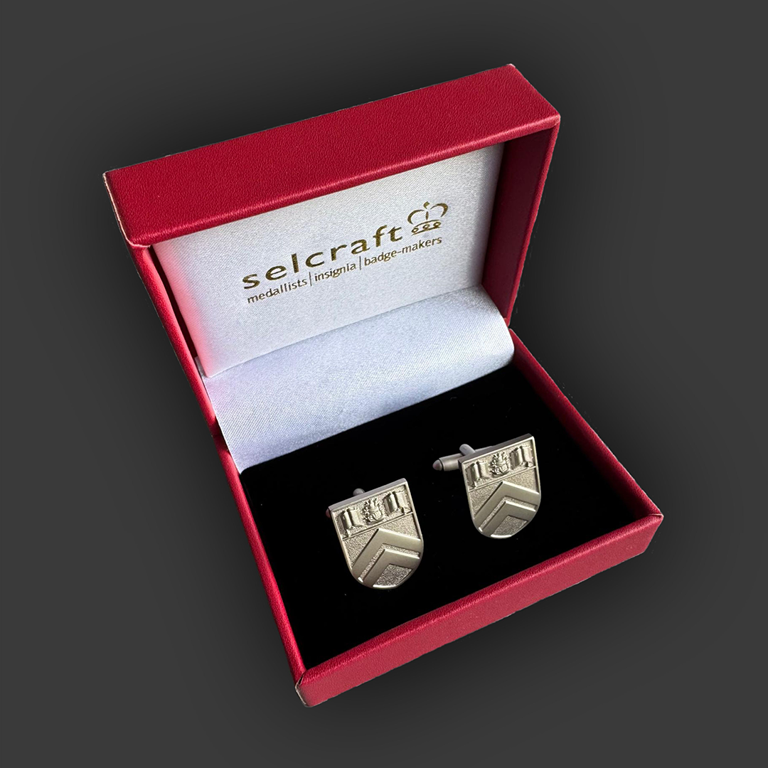 image of branded jewellery produced for Morrisons Academy displayed in its presentation case.  Jewellery and case designed and produced by Selcraft UK Ltd